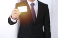 Businessman`s hand holding business card with empty space, close-up Royalty Free Stock Photo