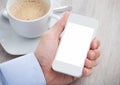 Businessman's hand holding cellphone with blank screen Royalty Free Stock Photo