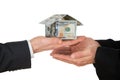 Businessman's hand holding house made of american dollar Royalty Free Stock Photo