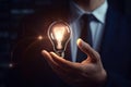 Businessman Hand Holding a Technology Light Bulb Depicting Smart Study Thinking of Success - Generative AI