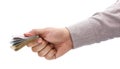 Businessman`s hand offering Brazilian money wad, concept of payment or government aid Royalty Free Stock Photo