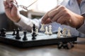 Businessman`s hand playing chess game to development analysis new strategy plan, business strategy leader and teamwork concept fo Royalty Free Stock Photo
