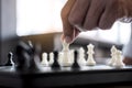 Businessman`s hand playing chess game to development analysis new strategy plan, business strategy leader and teamwork concept fo Royalty Free Stock Photo