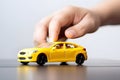 Businessman\'s Hand Protecting Toy Car. Concept insurance , generative ai Royalty Free Stock Photo