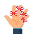 Businessman`s hand with Reminder string on finger.