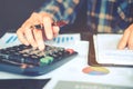 Businessman`s hands with calculator at the office and Financial data Cost Economic. Royalty Free Stock Photo