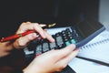 Businessman`s hands with calculator at the office and Financial data Cost Economic. Royalty Free Stock Photo