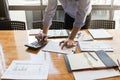 Businessman`s hands using calculator and Financial data analyzing on wooden desk at the office Royalty Free Stock Photo