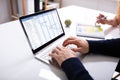 Businessman`s Hands Working On Gantt Chart On Laptop Royalty Free Stock Photo