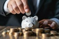 Businessman saving money concept. hand holding coins putting in piggy bank. Generative AI Royalty Free Stock Photo