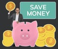 Businessman saving money in a piggy bank Royalty Free Stock Photo