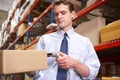 Businessman Scanning Package In Warehouse Royalty Free Stock Photo