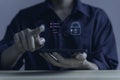 Businessman scans fingerprints for identity verification Biometrics. cybersecurity concept, smartphone electronic password to