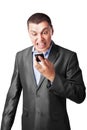 Businessman screaming in cell mobile phone Royalty Free Stock Photo