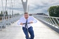 Businessman screaming in panic as he speeds along on a scooter