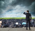 Businessman searches far for clean environment. overcome the global pollution problem Royalty Free Stock Photo