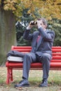 Businessman searching with binoculars