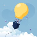 Businessman searching for opportunities in hot air balloon light bulb-Business concept vector