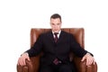 Businessman seated on a chair Royalty Free Stock Photo