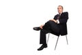 Businessman seated on a chair Royalty Free Stock Photo