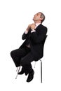 Businessman seated on a chair