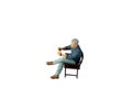 A businessman seated on a chair and sipping hot coffee isolated on white background with clipping path Royalty Free Stock Photo