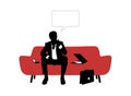 Businessman seated on red sofa and thinking