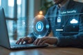 Businessman securing data with cyber security technology interface on laptop computer Royalty Free Stock Photo