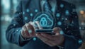 A businessman securing his digital information with a cloud-based security system on his smartphone Royalty Free Stock Photo
