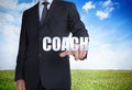 Businessman selecting coach word