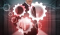 Businessman selecting futuristic cog and wheel interface