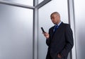 Businessman sending a message with his cell phone Royalty Free Stock Photo