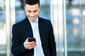 Businessman sending a sms outdoor Royalty Free Stock Photo