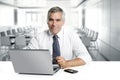 Businessman senior working interior modern office Royalty Free Stock Photo