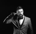 Businessman with serious face isolated on black background. Business and barbershop service concept. Man with long beard Royalty Free Stock Photo