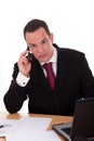 Businessman setting a desk talking on the phone