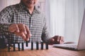 Businessman setting domino, concept of business start up