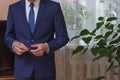 Businessman setting the tie straight