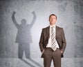 Businessman with shadow showing win