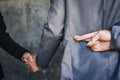 Businessman shake hand and betray Royalty Free Stock Photo