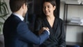 Smiling multiracial businesspeople handshake closing deal at meeting Royalty Free Stock Photo