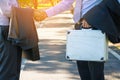 Businessman,They are shake hands  in park. Royalty Free Stock Photo