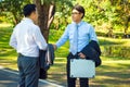 Businessman,They are shake hands  in park. Royalty Free Stock Photo