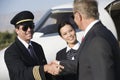 Businessman Shaking Hands With An Airplane Captain Royalty Free Stock Photo