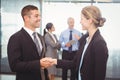 Businessman shaking hands with businesswoman Royalty Free Stock Photo
