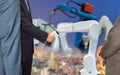 Businessman shaking hands cooperation with robot robotic arm future industry 4.0 Royalty Free Stock Photo