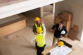 Businessman shaking hands with engineers in construction, construction site renovation concept, architect engineer Royalty Free Stock Photo