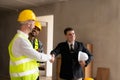 Businessman shaking hands with engineers in construction, construction site renovation concept, architect engineer Royalty Free Stock Photo