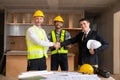 Businessman shaking hands with engineers in construction, construction site renovation concept, architect engineer Royalty Free Stock Photo