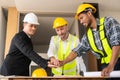 Businessman shaking hands with engineers in construction, construction site renovation concept, architect engineer Royalty Free Stock Photo